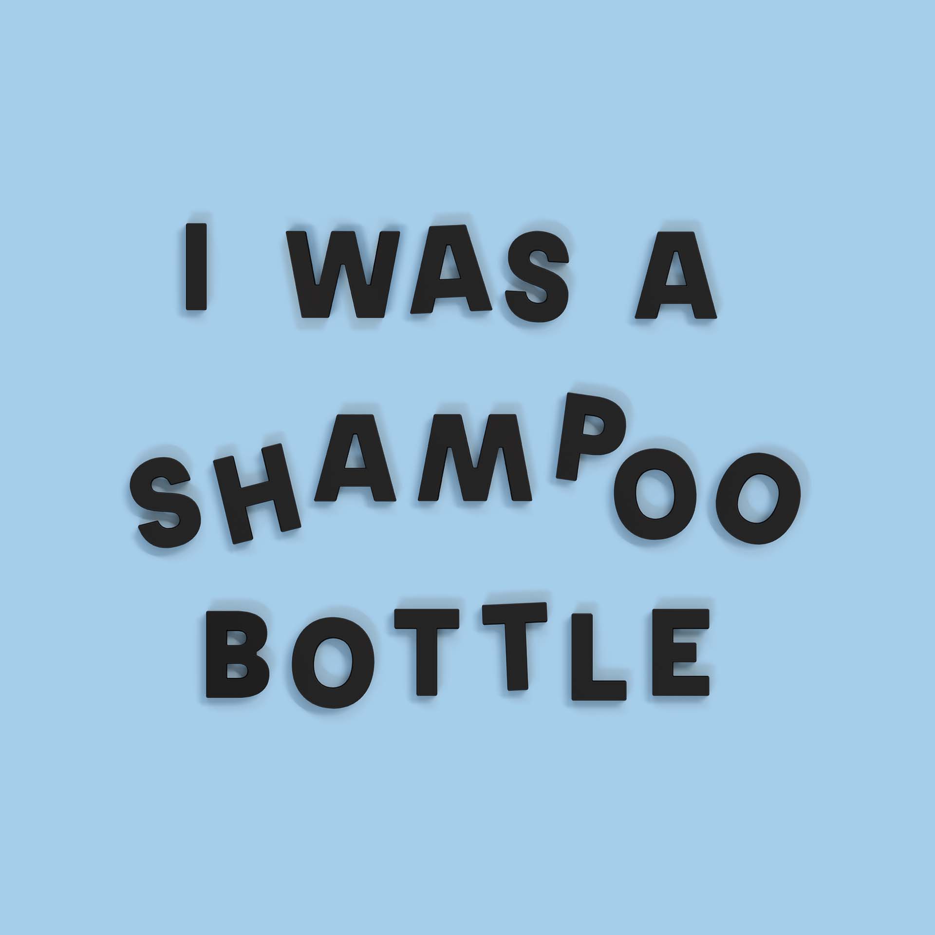 sky blue background with black wordbits strong magnetic alphabet magnets spelling "i was a shampoo bottle" to illustrate that they are made from post-consumer recycled plastic