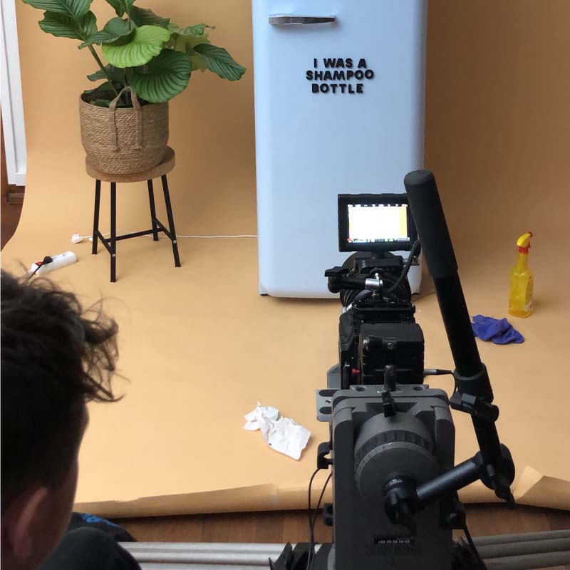 Behind the scenes of Wordbits Kickstarter video shoot with blue fridge on orange background